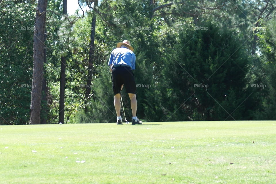 Man playing golf