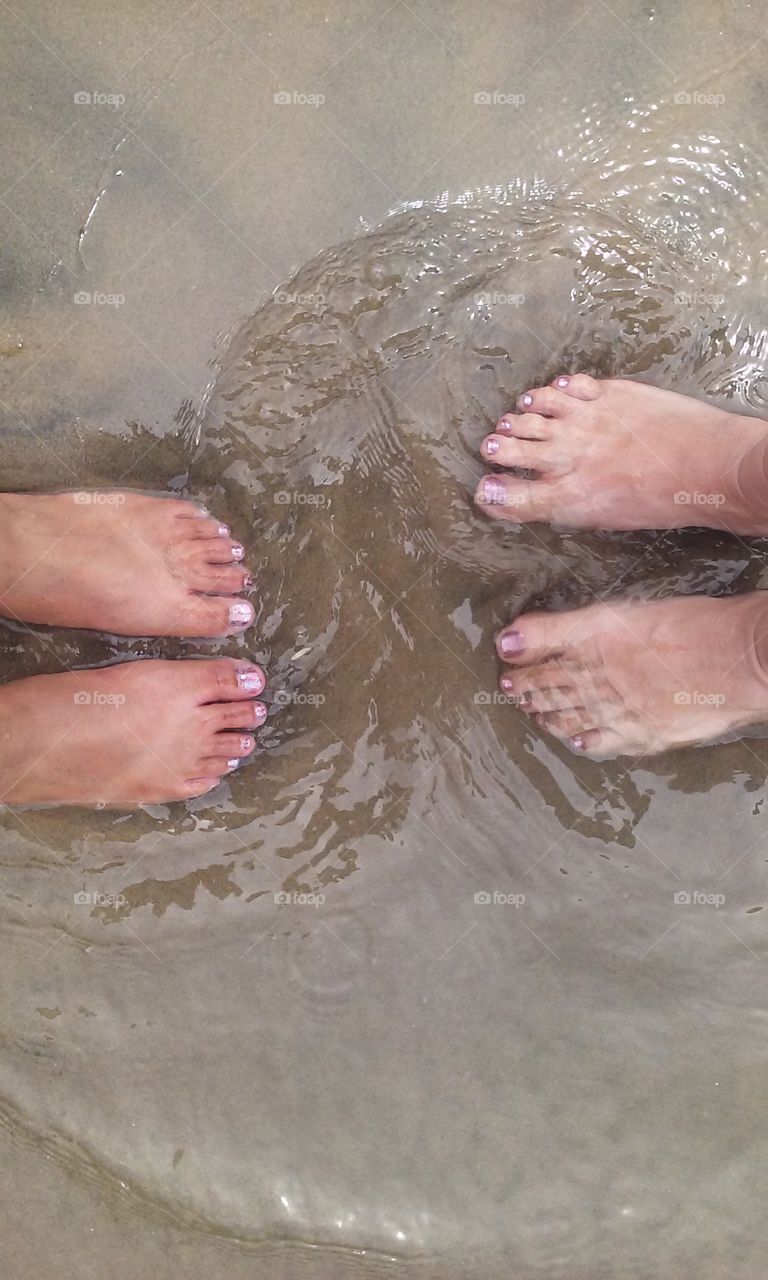 foot friends. my friend and I at the beach