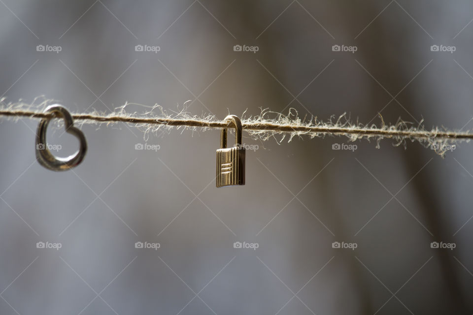 heart and lock on the rope . 
inaccessible heart concept