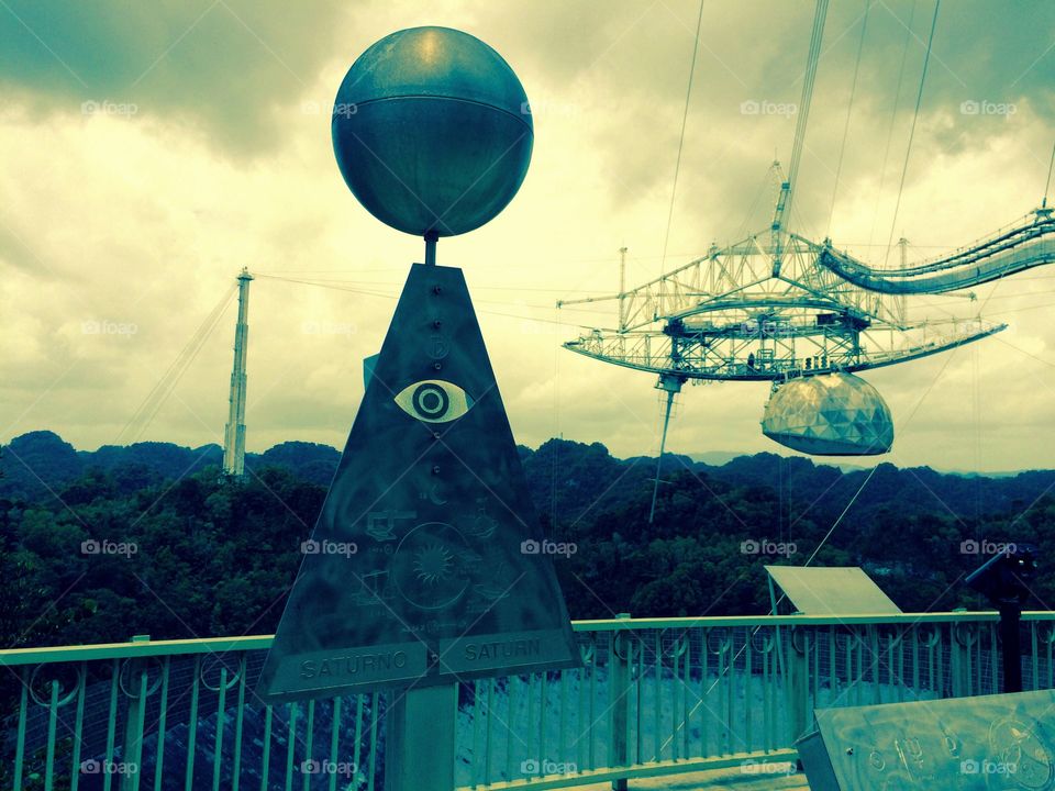 Eyes and Ears to Space. The Arecibo Radio Telescope hidden on the top of the mountains in Arecibo, Puerto Rico.