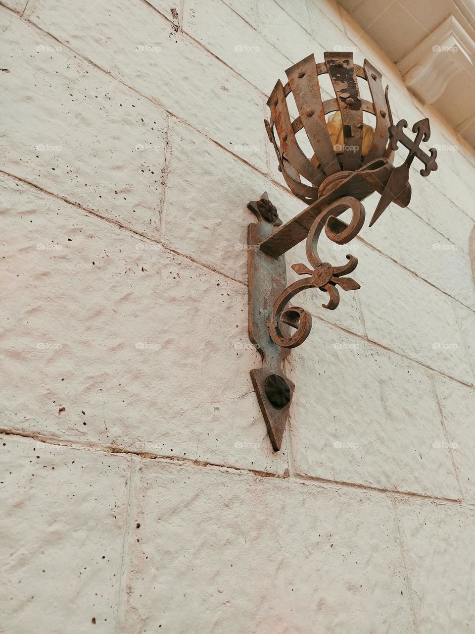 spectacular wrought iron lantern from the Middle Ages, decorative that enhance time, its beauty, color and strength