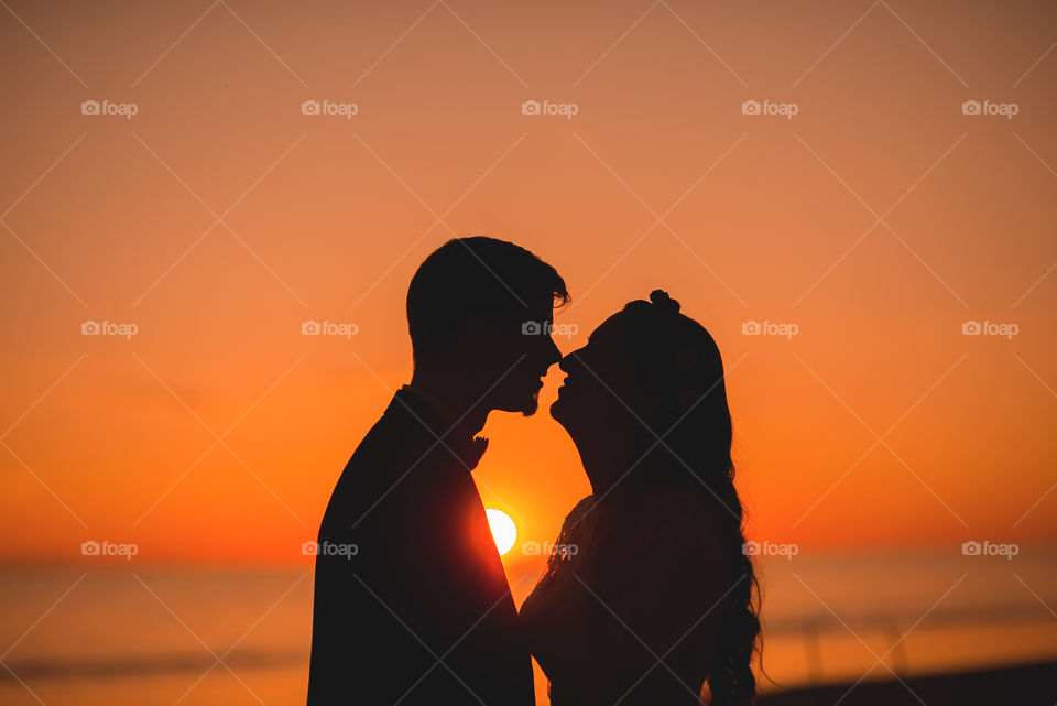 Silhouettes of couple during sunset