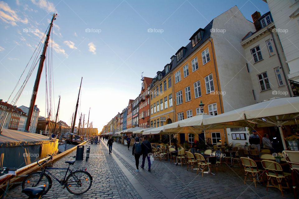 The sun is setting over Nyhavn in Copenhagen 