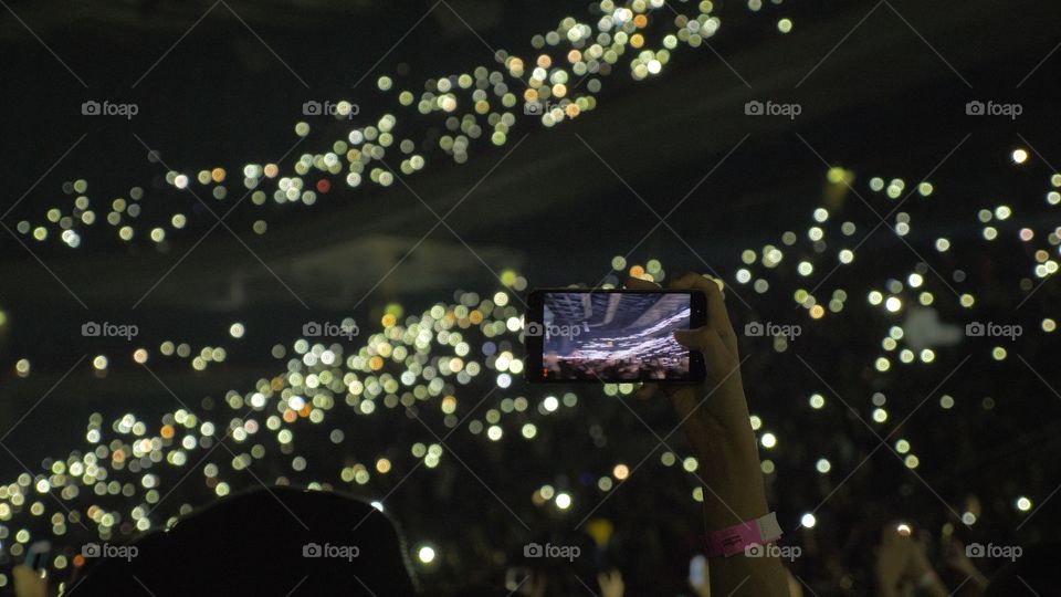 fans at a concert with phones