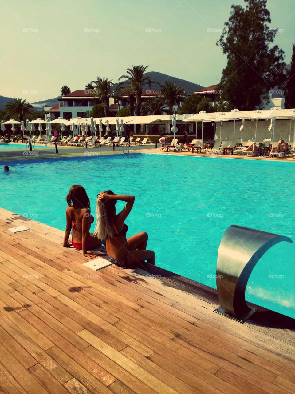 summer time. pool and two girls