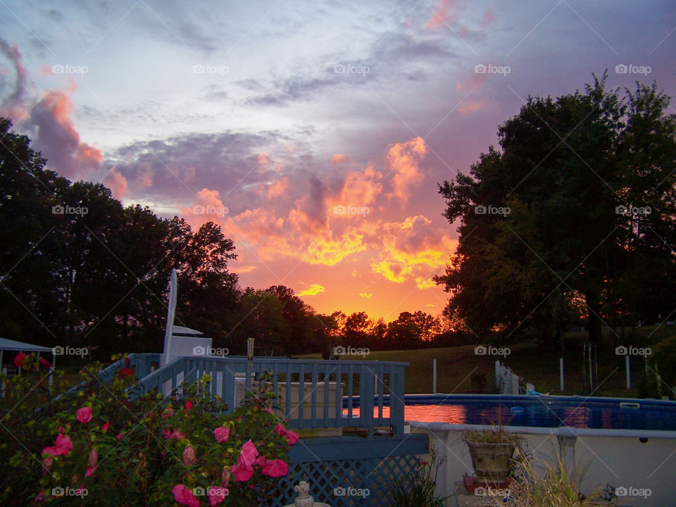 sunset over a pool