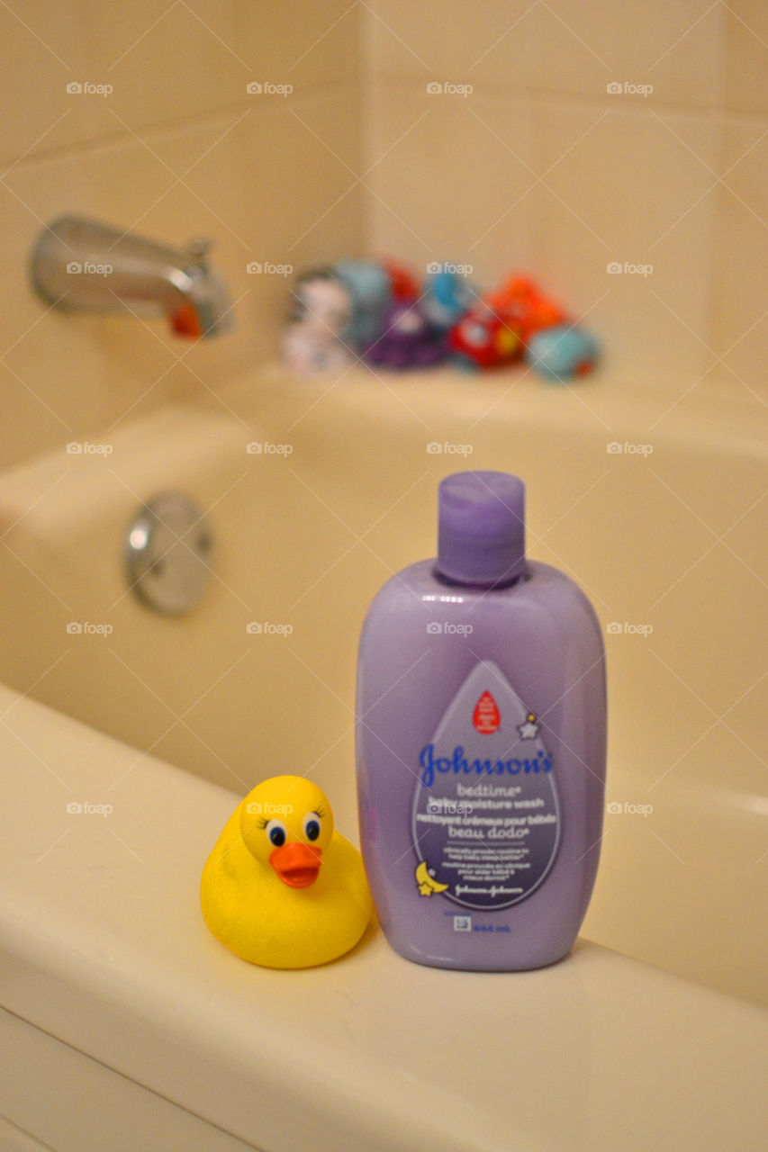 Shampoo bottle next to rubber duck