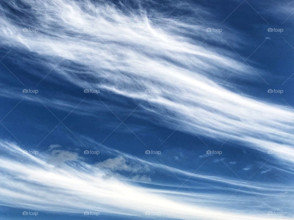 A very different cloud formation in the deep blue of the sky in an Autumn Day afternoon.