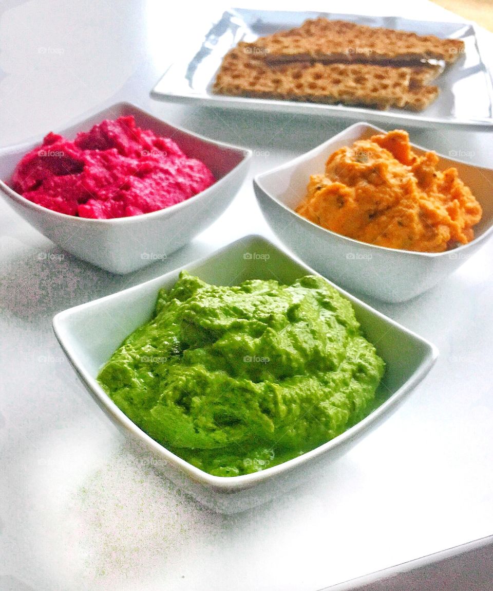 Beetroot avocado carrot dip with wheat crackers 