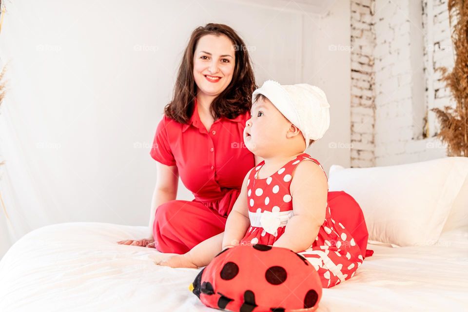 cute little baby in red polka dot dress