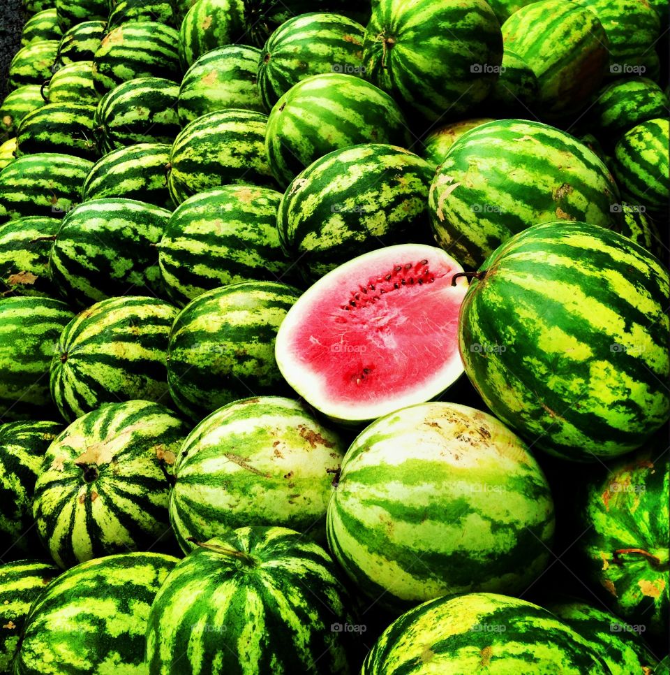 green watermelons on a street market