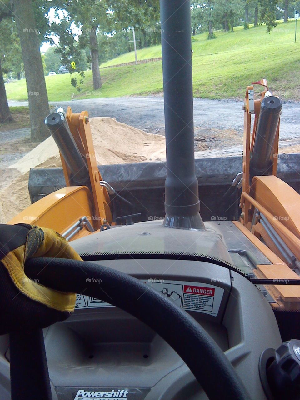 Working the backhoe in the park