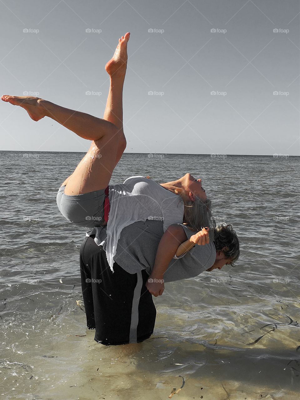 Man carrying woman on his back