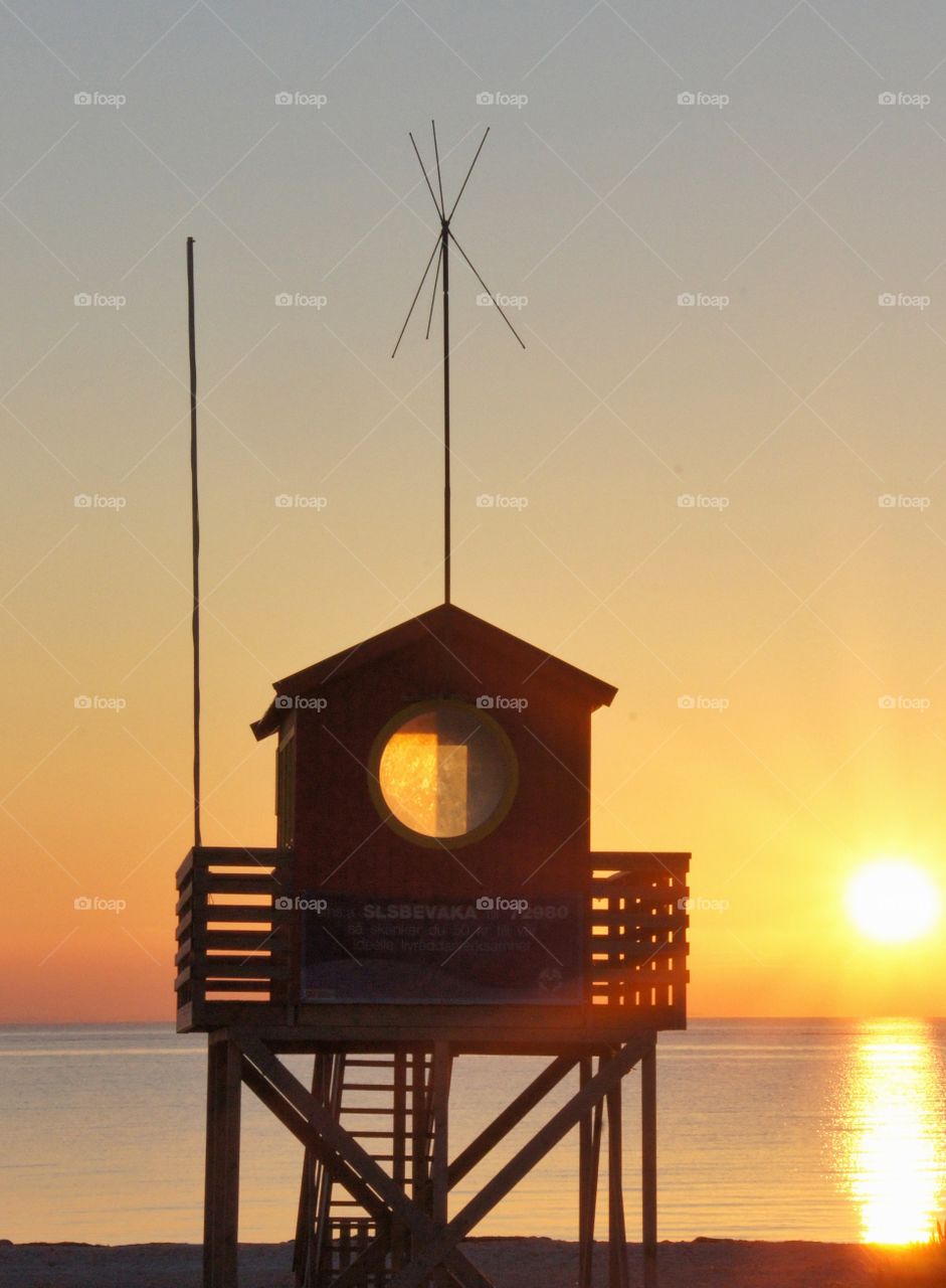 Lifeguard tower in sunset