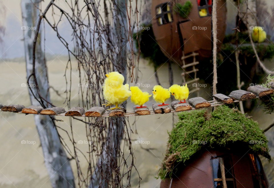 Easter landscape, chickens walking on bridge.