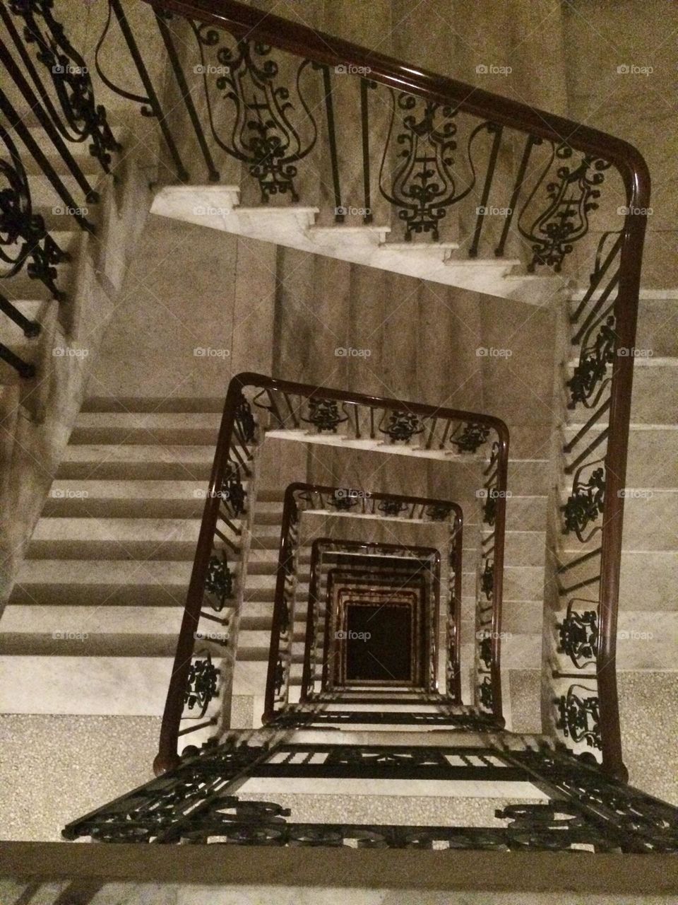 Architectural marble square spiral staircase to infinity