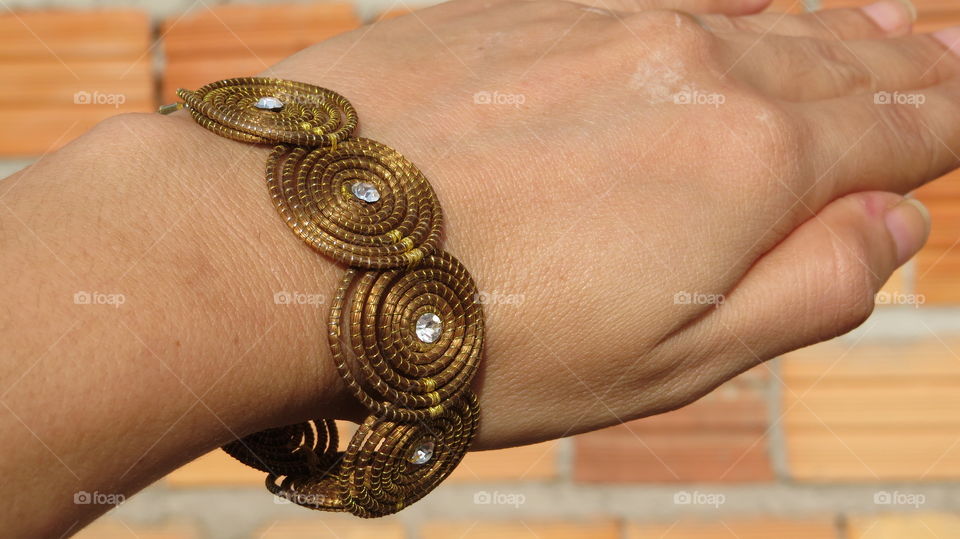 buriti straw bracelet Brazilian tree intertwined with wire and gold thread . handmade ecological jewel