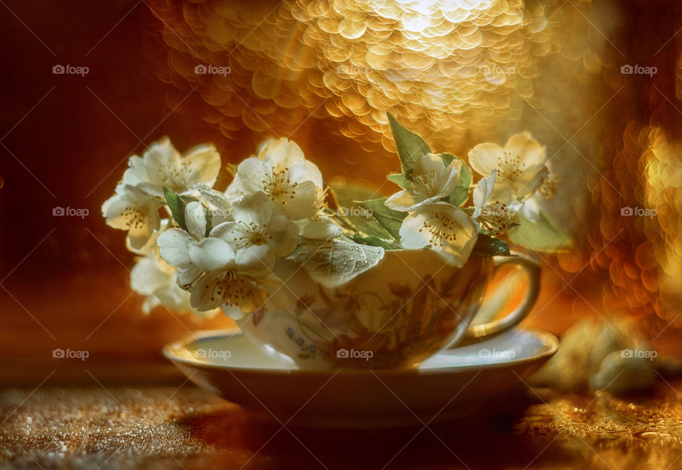 Jasmine flowers in a ceramic cup