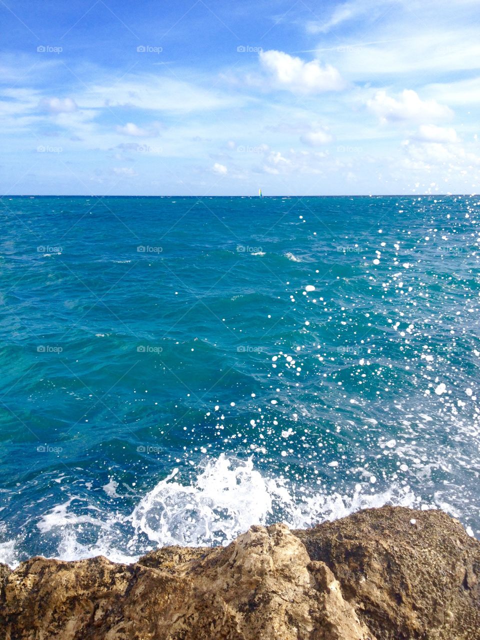 Waves crushing on rock