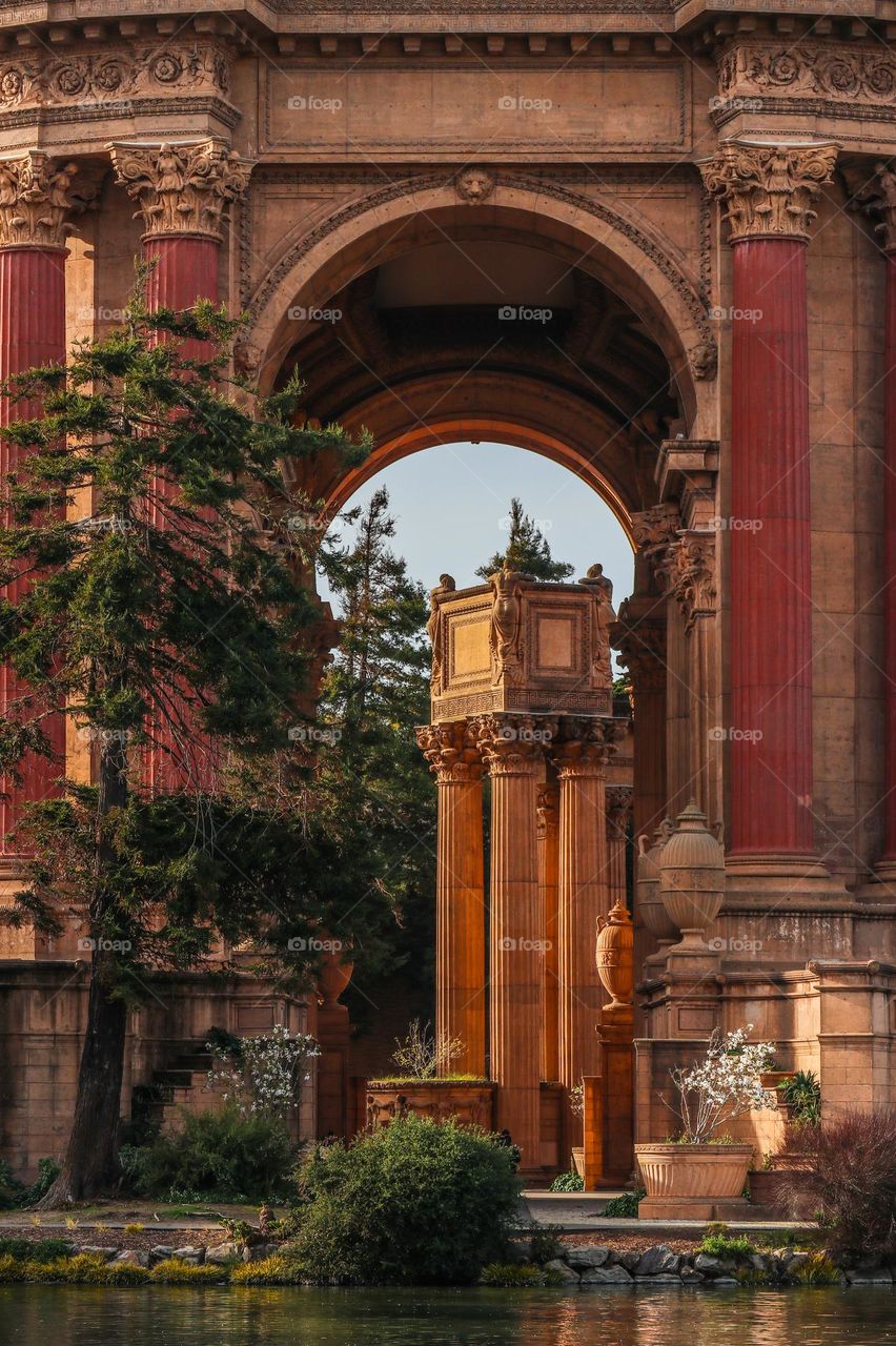 Close up view of the Palace of Fine Arts in San Francisco California, showcasing the stunning Greco Roman architecture with its grand arches and stunning columns 