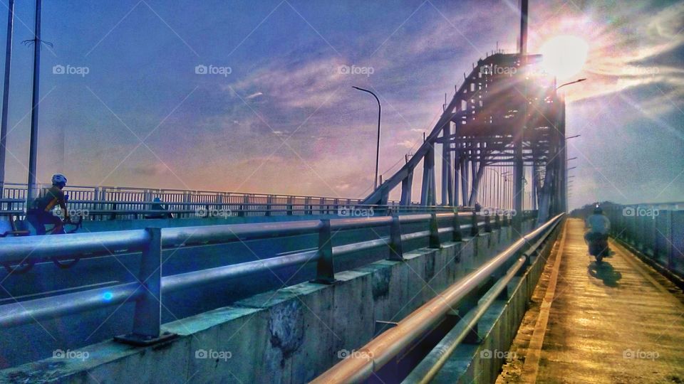 the atmosphere of the city in the morning on the bridge of the pride of the city of samarinda, Indonesia