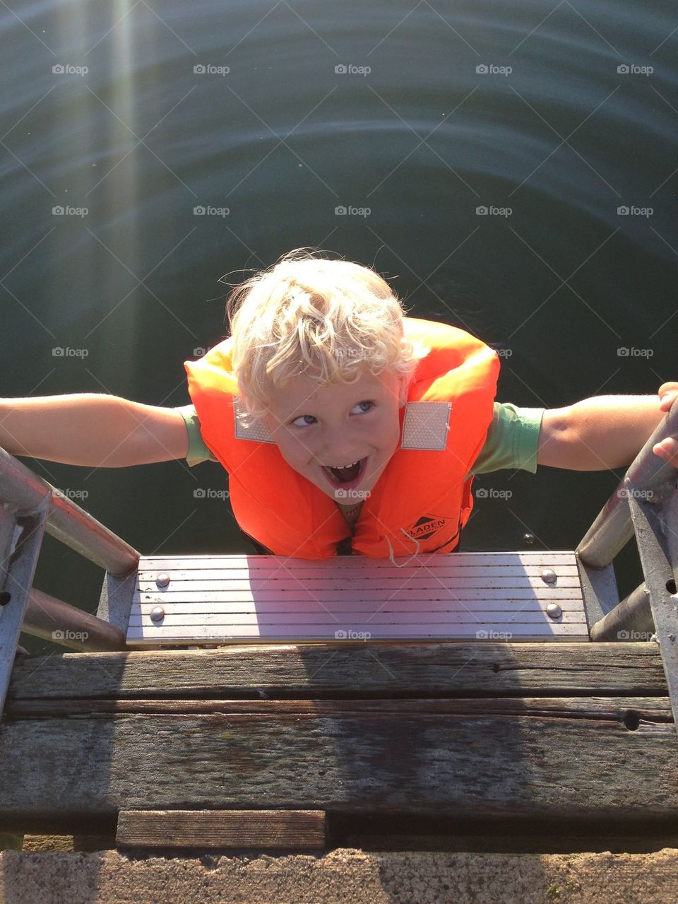Happy boy in lifejacket