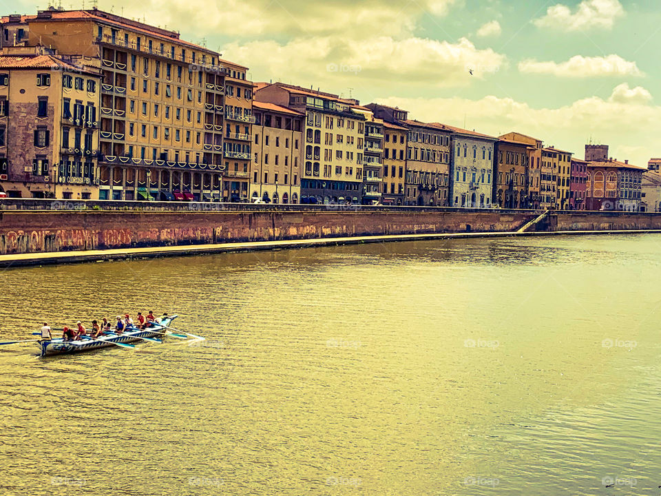 Ten people on kayak in the river . 8 oars 