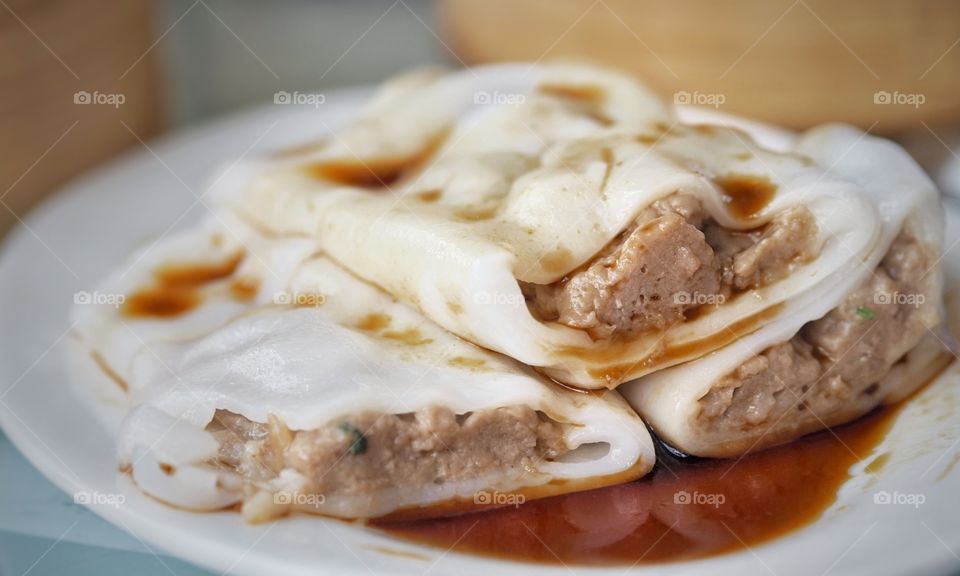 Beef rice noodle rolls topped with a splash of sweet soy sauce . A popular food item in a yum cha or dim sum line up. The dish has a smooth mouthfeel. It is usually kept warm inside a bamboo steamer. Also known as "cheong fun", "cheung fun" or "cang-fen".