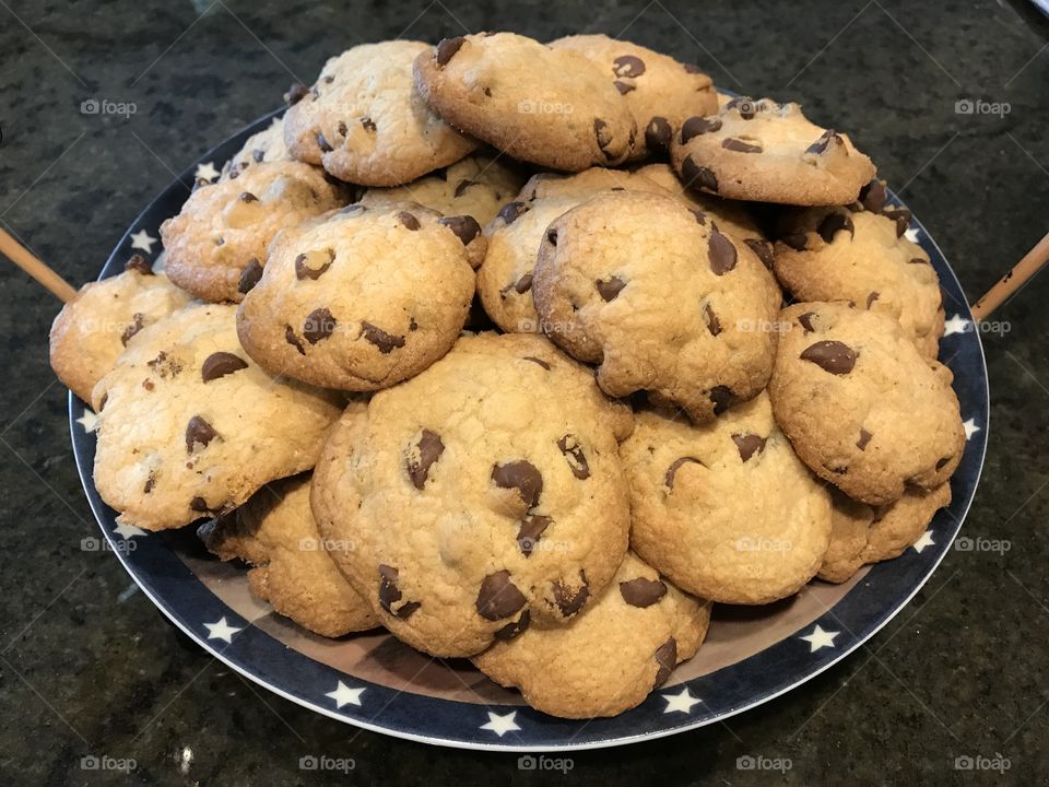 Beautiful pile of chocolate chip cookies on plate