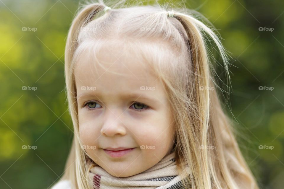 Little Caucasian girl with blonde hair feeling fear