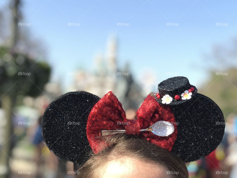 Mickey Mouse Ears Mary Poppins in front of the castle at Disneyland
