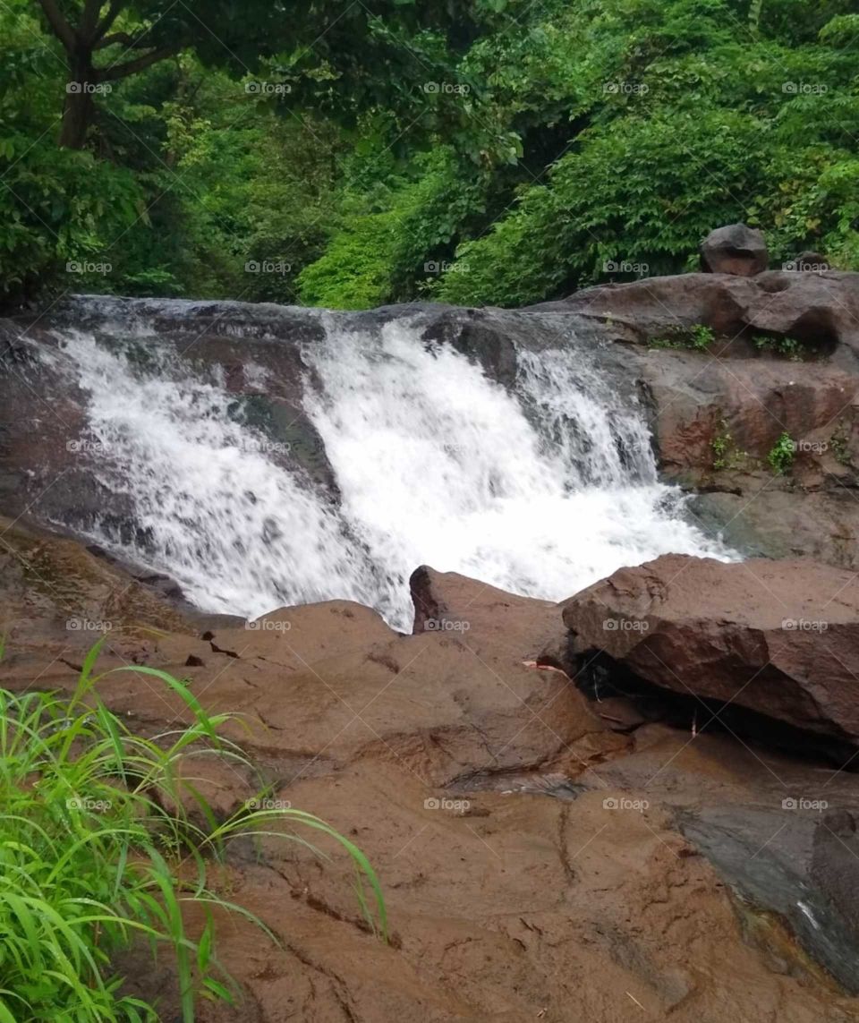 Mini waterfall
nature's beauty
rainy season's scenes