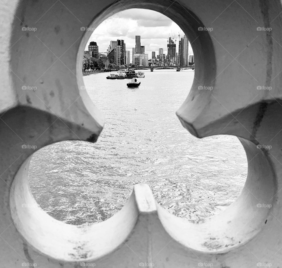 London architecture city skyline framed within a clover-shaped bridge architectural element