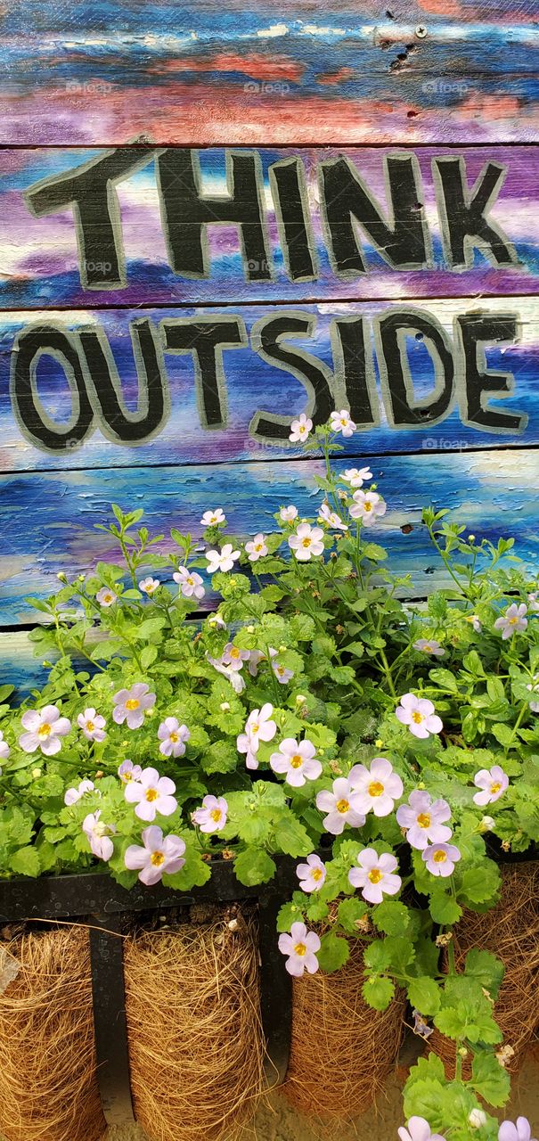 Sign with flower planter box