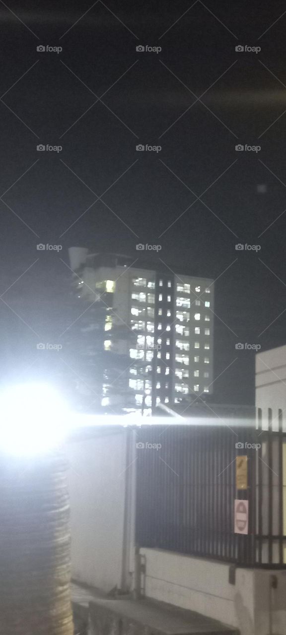 Twinkling windows , the beauty of evening light. Bask in the beauty of evening light with the view of light twinkling from these windows at night