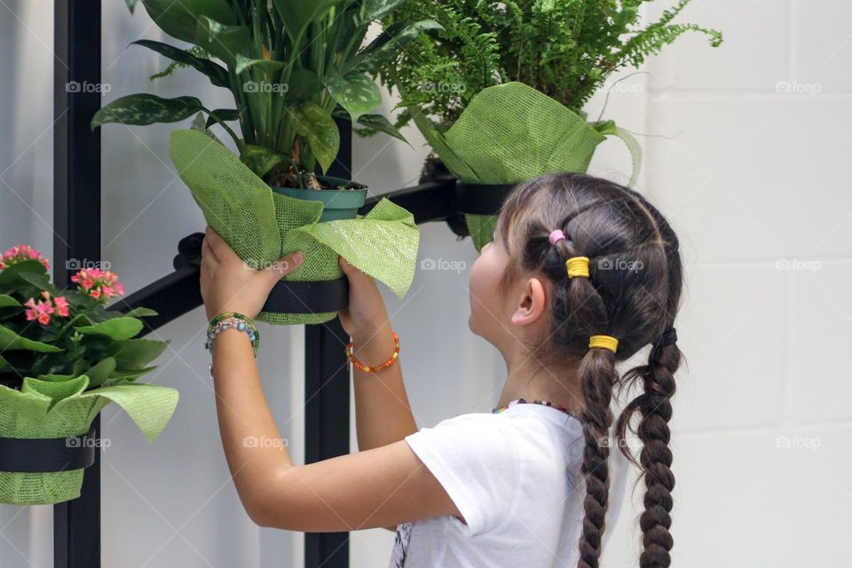 Girl is planting flowers