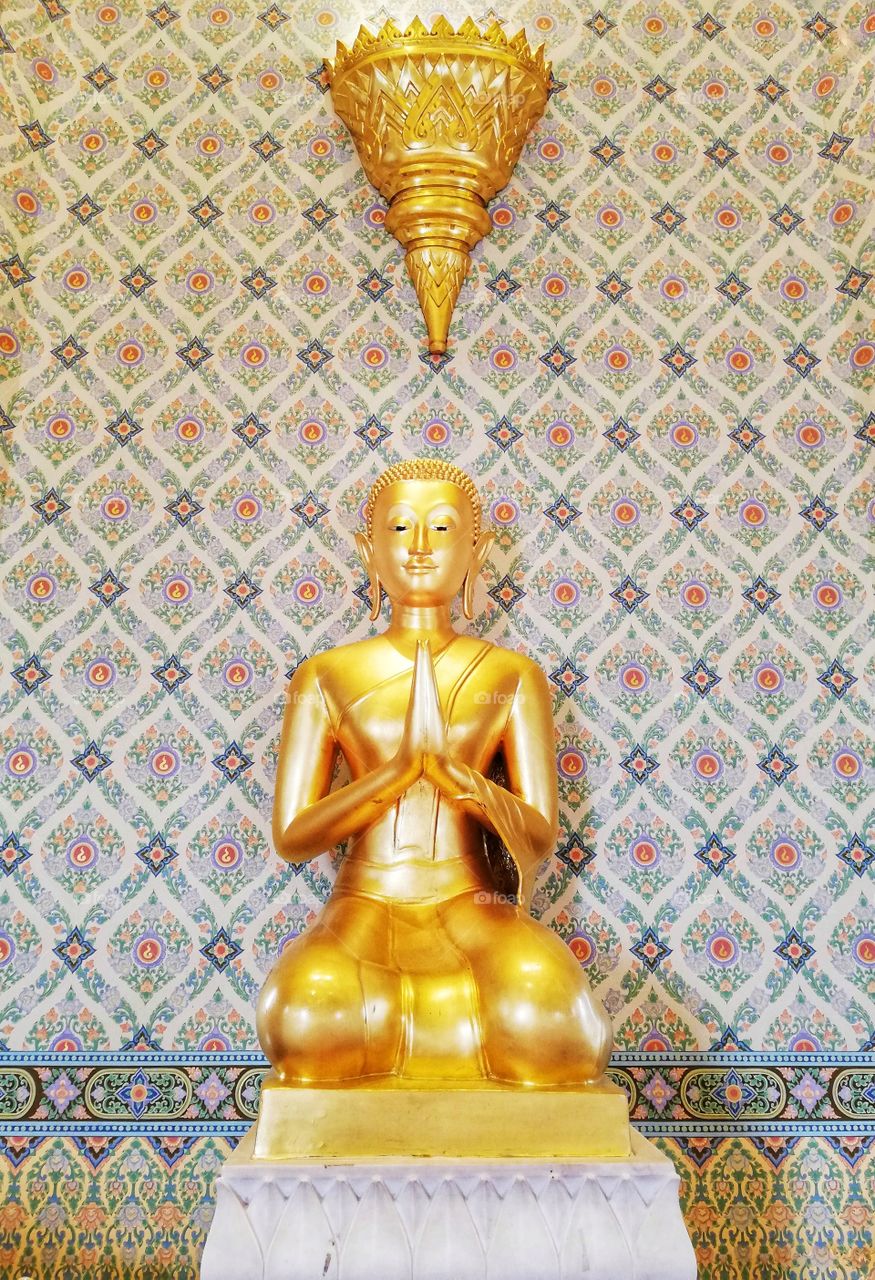 Golden buddha statue in a Thai temple