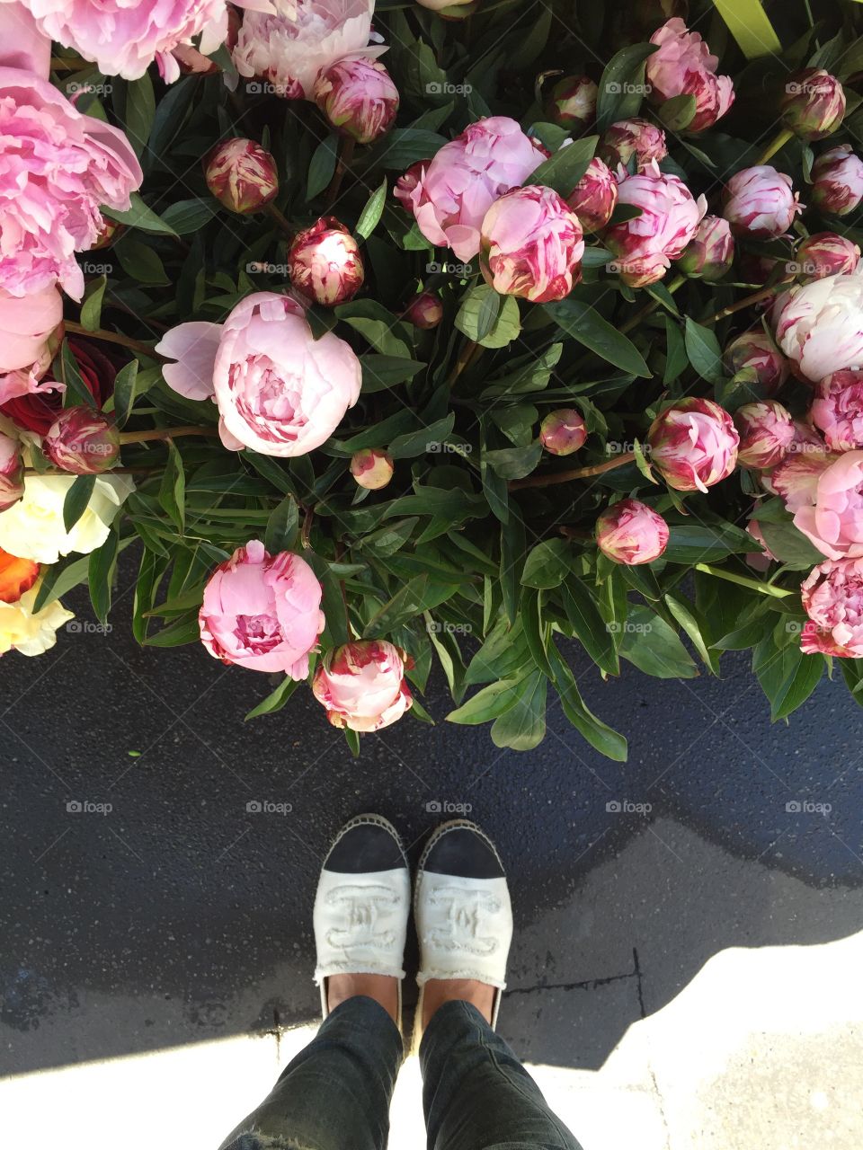 Peonies outside a convenience store in Paris