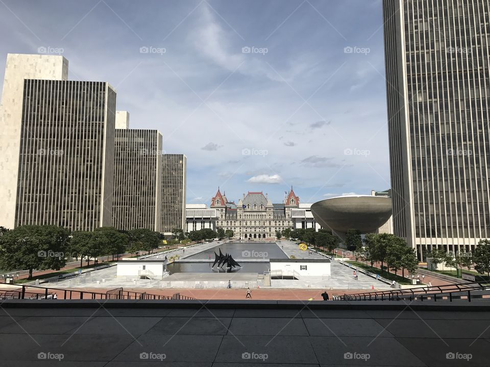 A view of the Nelson Rockefeller Empire State plaza, in Albany NY. on the left are the 4 agency buildings. The Capitol building is straight ahead. "The Egg" is towards the right of the photo, and there is a partial view of the mayor Erastus Corning Tower. 