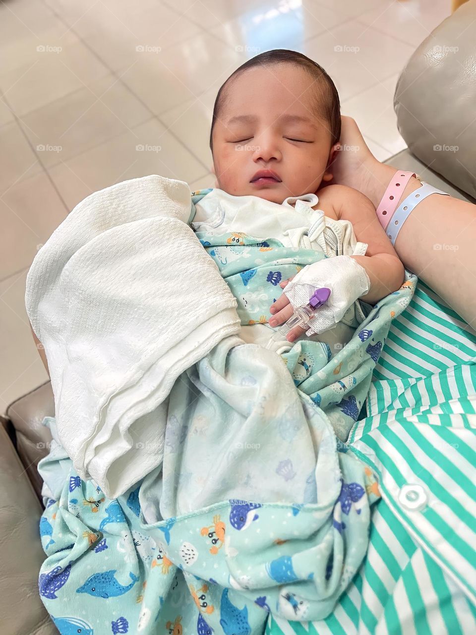 High angle view of baby boy sleeping on bed at home