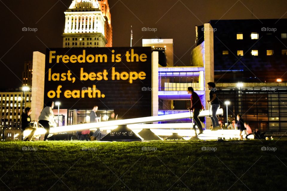 Freedom is the last, best hope of Earth, read a light projection on the side of a museum. 