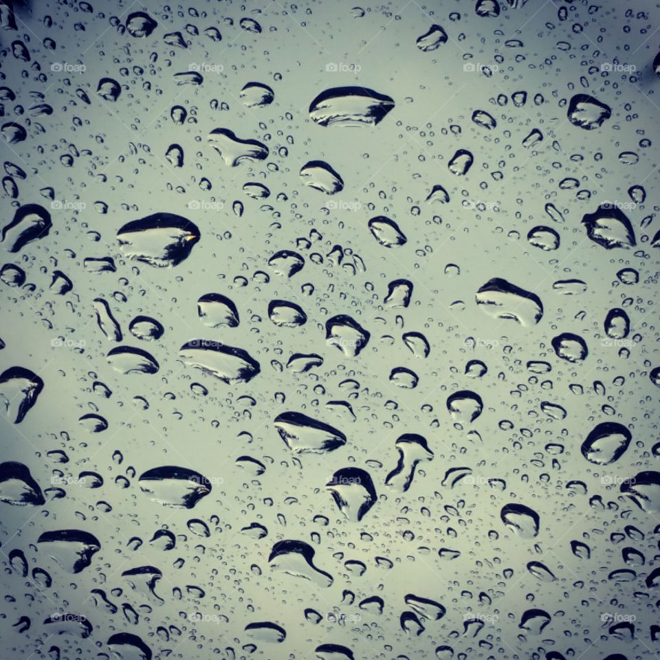 Rain Drops . Rain droplets reflects of glass 