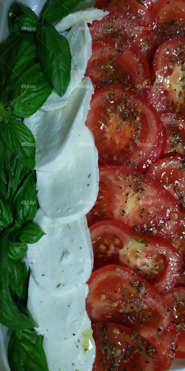 The Caprese salad, besides being very tasty, has the three colors of the Italian flag. In fact, the name "Caprese salad" means "Capri salad" near Naples. The ingredients are: "RED tomato", "WHITE mozzarella" and "GREEN basil".
