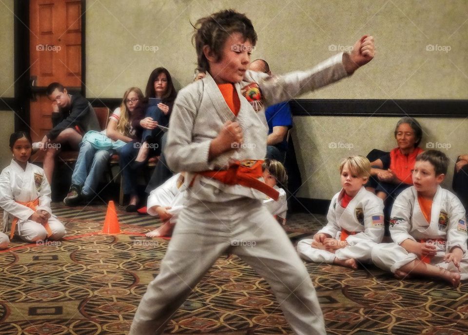 Karate Kid. Young Boy In A Karate Tournament
