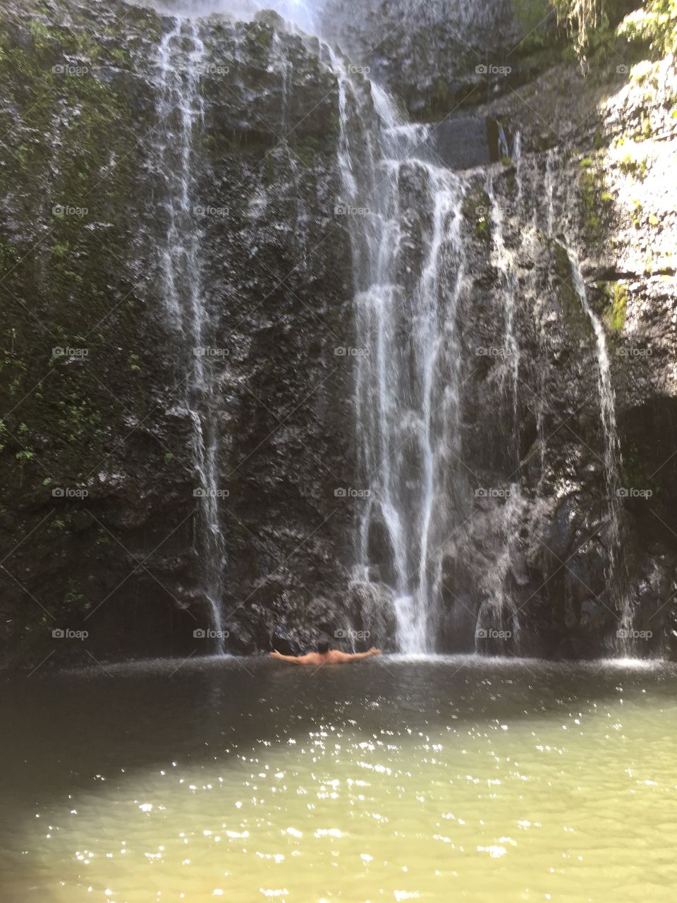A quick dip in a large, cold, breathtaking waterfall found on our drive along side the Road to Hana in Maui, Hawaii. 