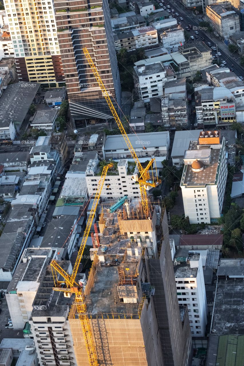 Construction crane on skyscraper