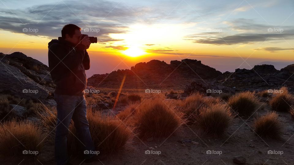 Side view of man photographing