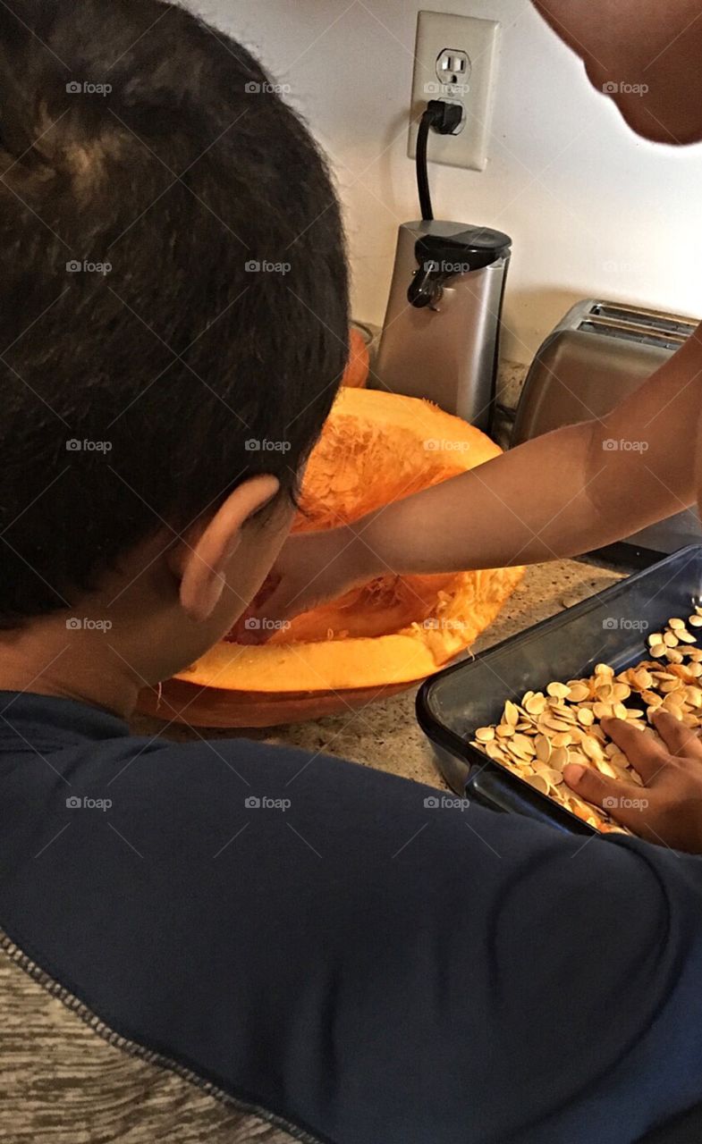 Kids preparing to bake pumpkin