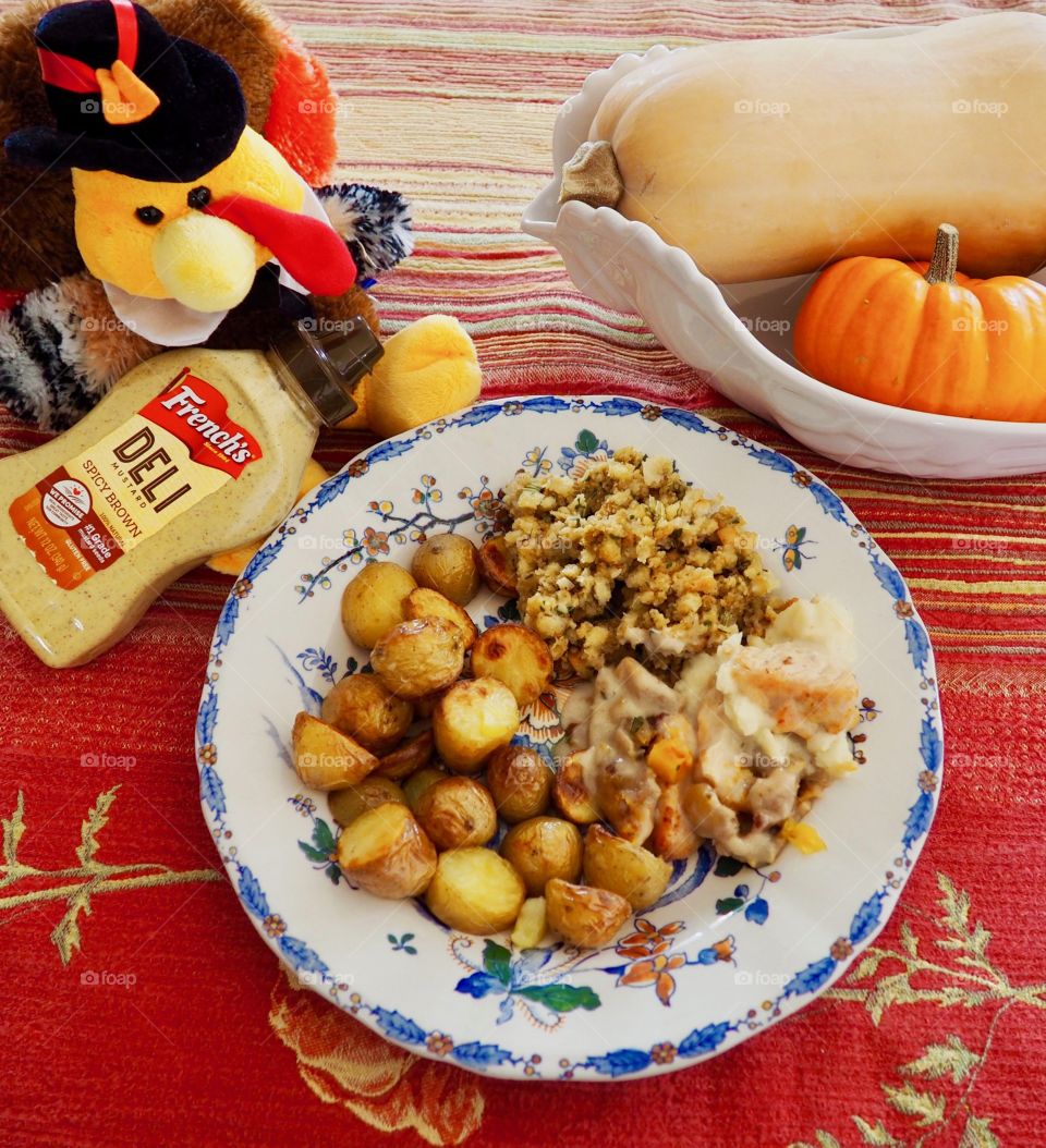 Thanksgiving plate of turkey in a creamy French’s deli and honey mustard sauce with stuffing and roasted potatoes.