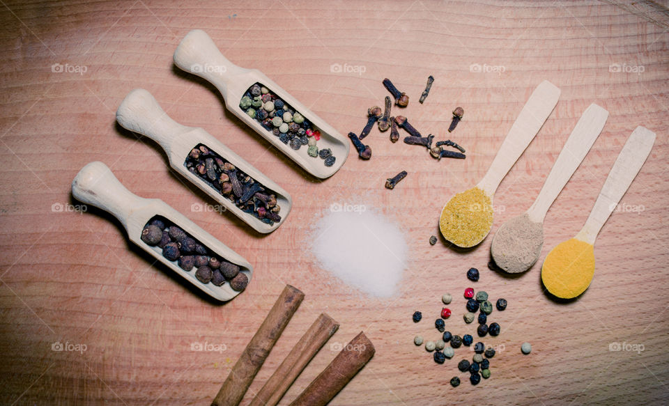 Raw pasta with ingredients and wooden accessories